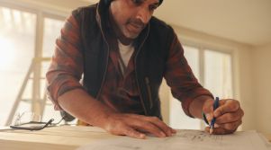 Man sketching kitchen renovation plans